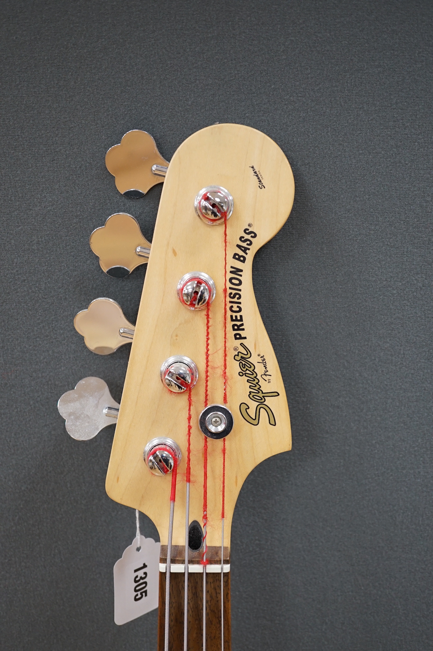 Squire by Fender, a Precision bass guitar with Torque T303MT amplifier